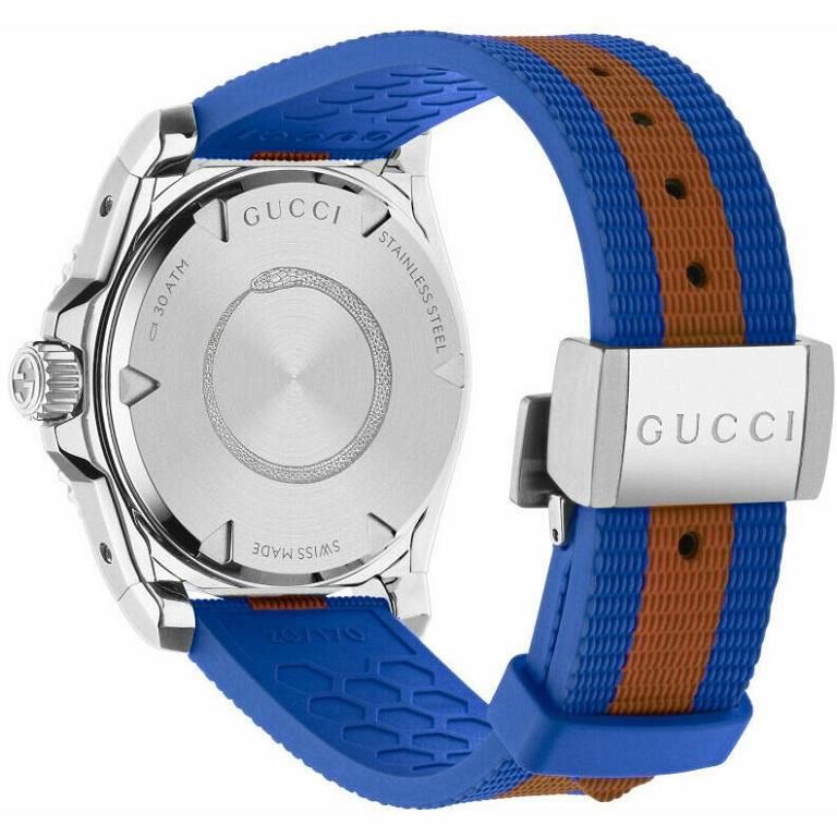 A new introduction to the Dive family, the watch combines the House symbolic elements: the Web stripe and the Gucci bee. Designed with a steel case and a steel bezel, the accessory is defined by a dark grey dial featuring the emblematic bee motif. A