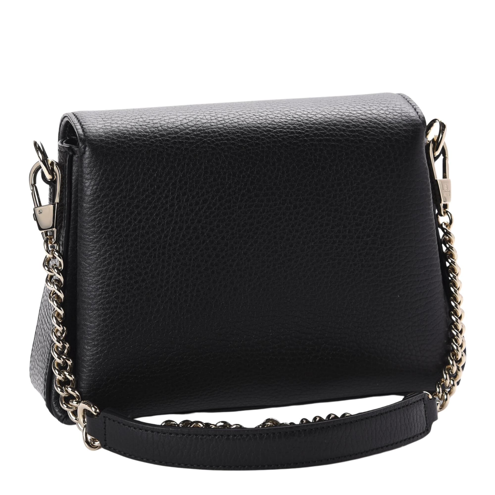 This crossbody bag is made of grained calfskin leather in black. The bag features polished light gold hardware, a chain link shoulder strap with a leather shoulder pad and a top crossover flap with an interlocking GG flip lock closure. The The top