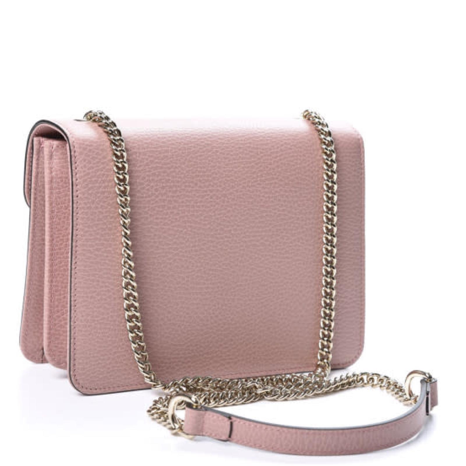 The bag has a waist-length shoulder strap in sliver tone and a front flap with an interlocking GG emblem. The flap opens to a partitioned fabric interior with a patch pocket.

COLOR: Pink
MATERIAL: Leather
ITEM CODE: 510304 204991
MEASURES: H 5.75