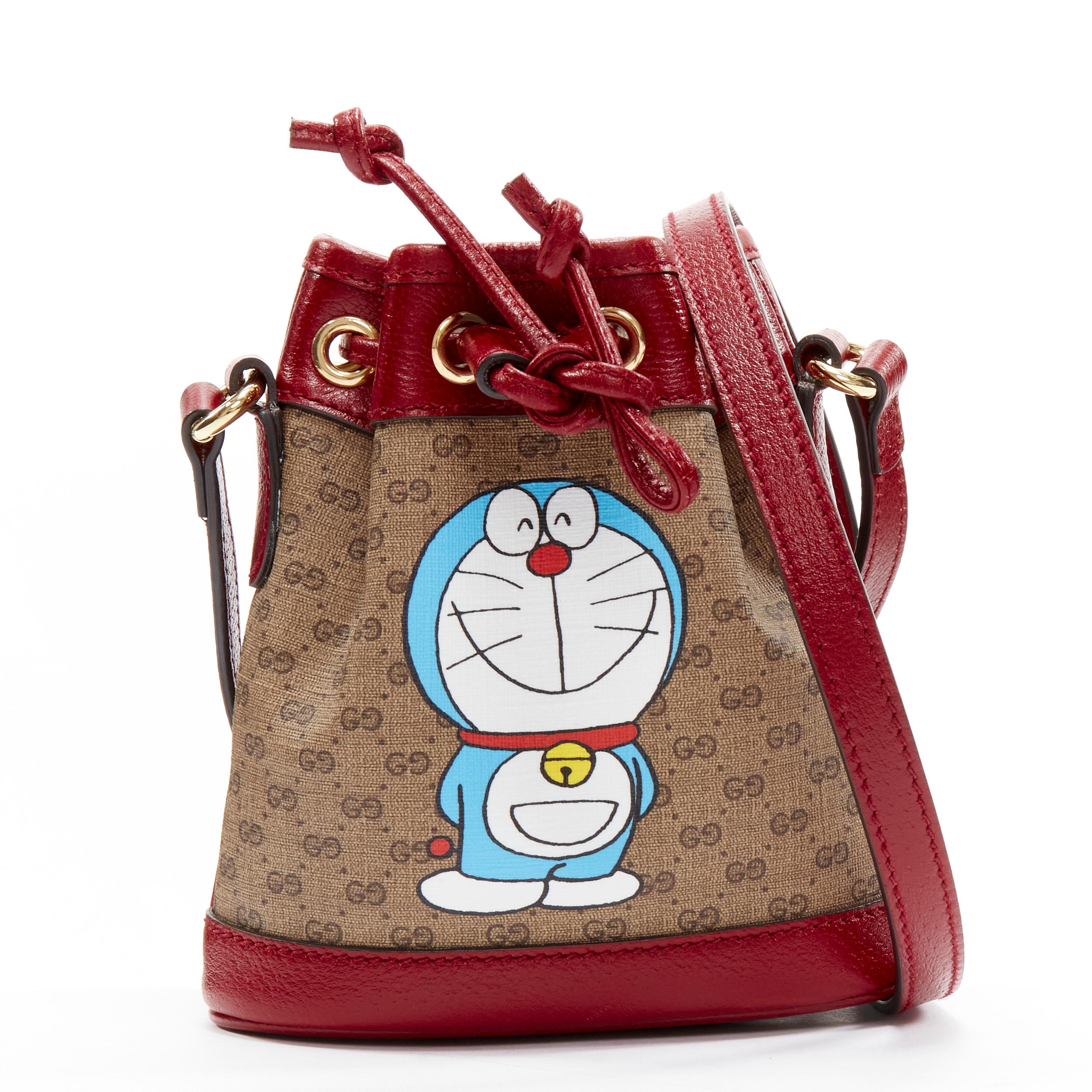 GUCCI DORAEMON 2021 Limited GG Supreme red drawstring crossbody bucket bag
Reference: TGAS/C01646
Brand: Gucci
Designer: Alessandro Michele
Collection: Doraemon - Runway
Material: Canvas, Leather
Color: Brown, Burgundy
Pattern: Monogram
Closure: