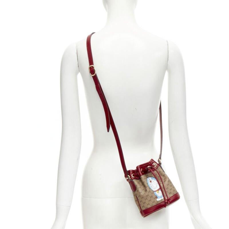 GUCCI DORAEMON 2021 Limited GG Supreme red drawstring crossbody bucket bag
Reference: TGAS/C01515
Brand: Gucci
Designer: Alessandro Michele
Collection: Doraemon
Material: Canvas, Leather
Color: Beige, Red
Pattern: Monogram
Closure: