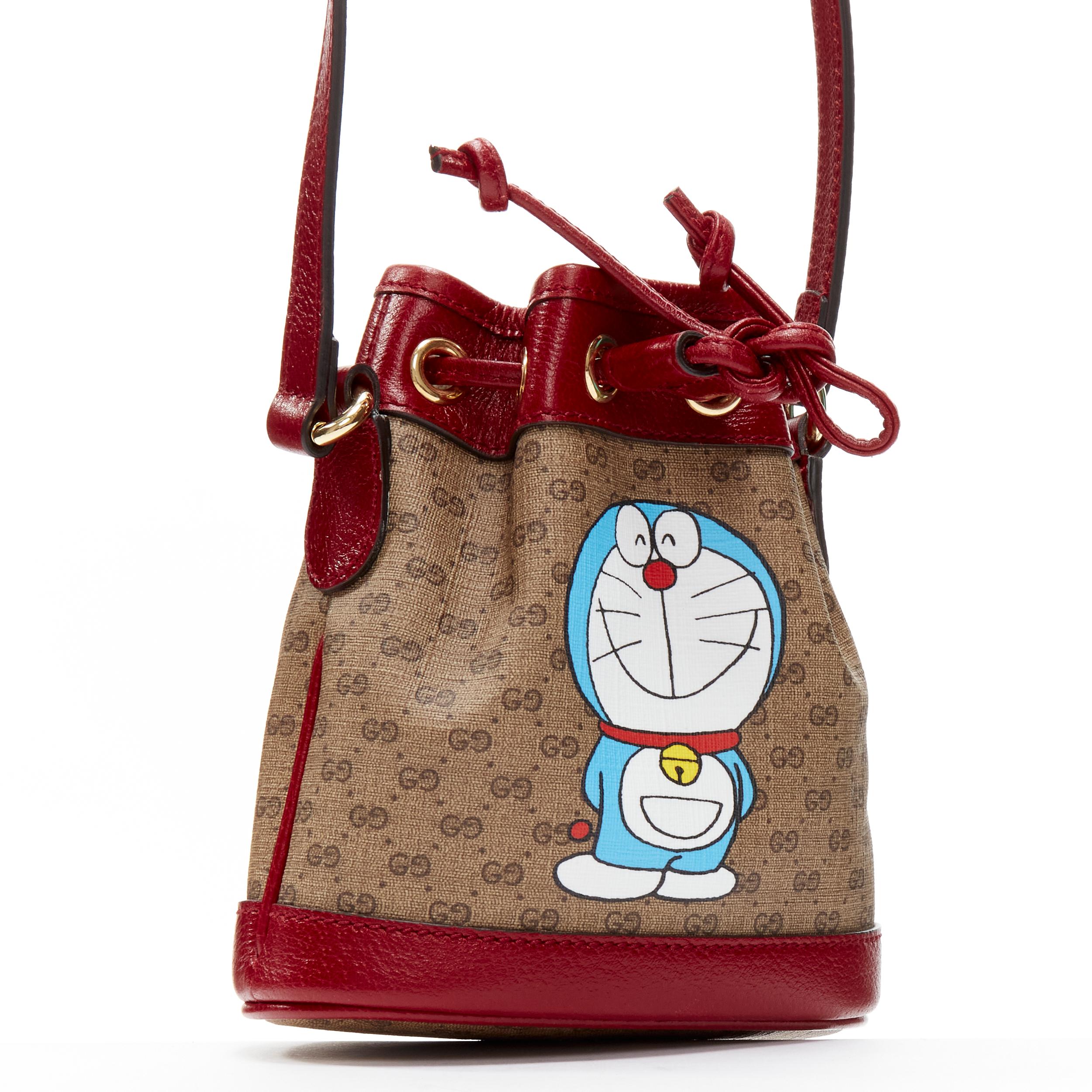 Brown GUCCI DORAEMON 2021 Limited GG Supreme red drawstring crossbody bucket bag For Sale
