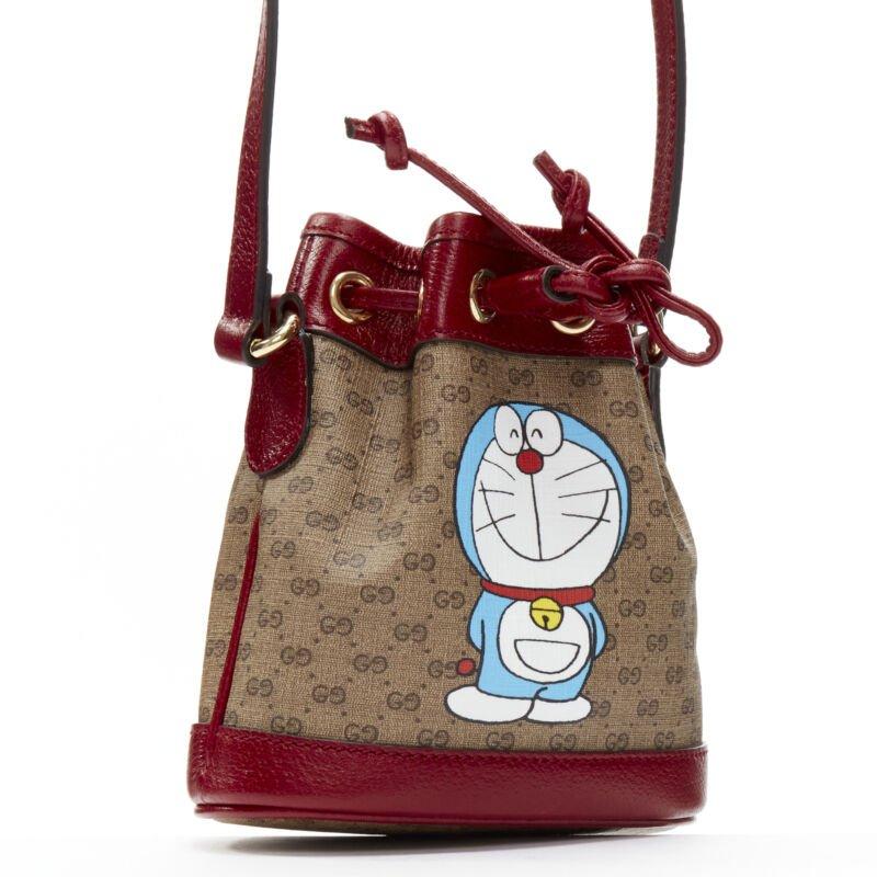 Brown GUCCI DORAEMON 2021 Limited GG Supreme red drawstring crossbody bucket bag