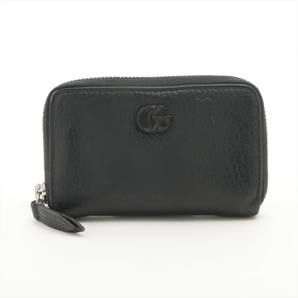 The Gucci Double G Leather Coin Purse in black is a stylish and practical accessory that combines luxury with functionality. Made from high-quality leather, the compact coin purse features iconic Double G logo on the front, adding a touch of