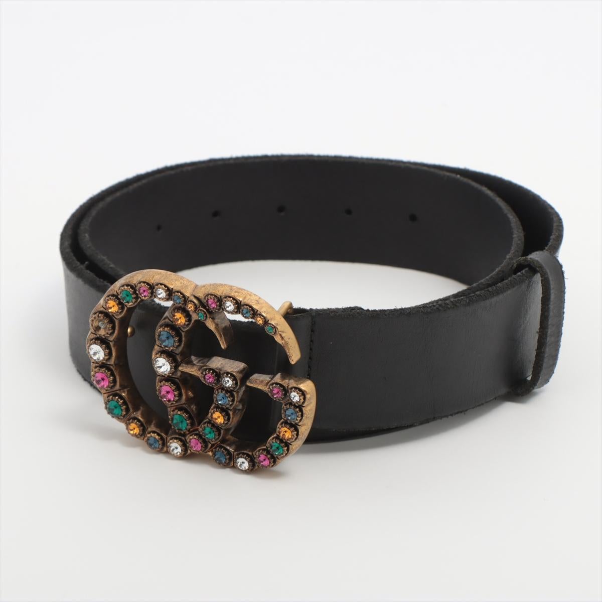The Gucci Double G Multicolor Rhinestone Belt in Black is a bold and glamorous accessory that adds a statement touch to any outfit. Crafted from smooth black leather, the belt features the iconic Double G buckle encrusted with vibrant multicolor
