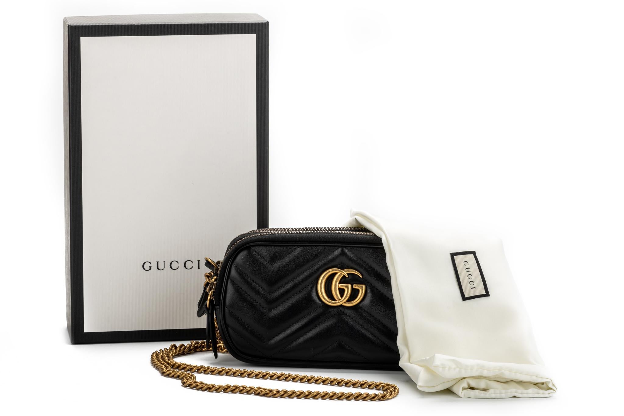 Gucci black lambskin double zipper cross body bag with gold tone hardware. Excellent condition. 22