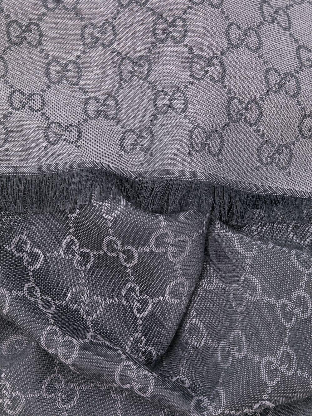 Crafted in Italy from an intricate blend of wool and silk in a neutral palette of dove grey and cream, this monogram print scarf from Gucci features an all-over GG print design and fringed edges.

Colour: Dove Grey

Composition: 80% Wool, 20%