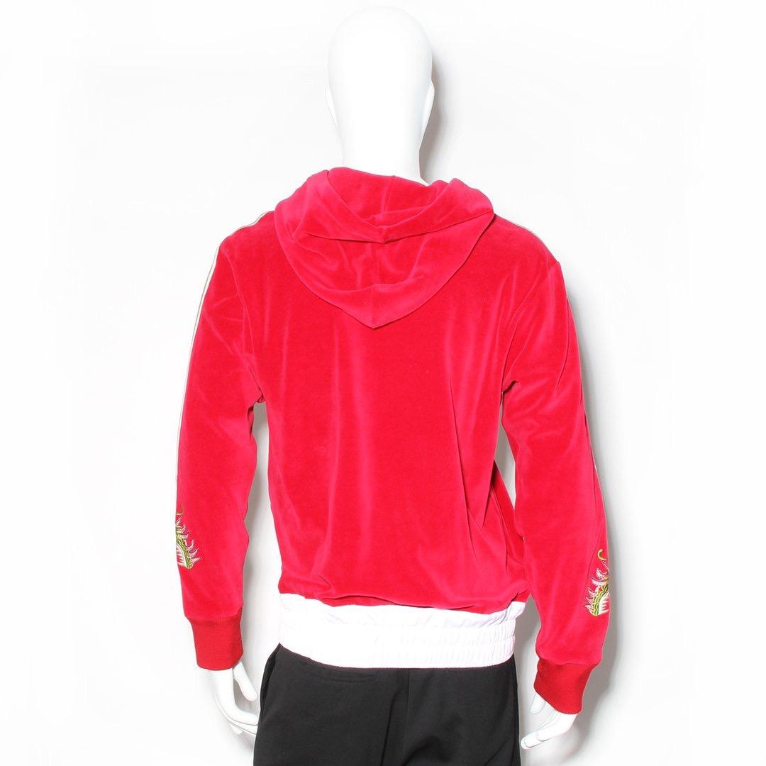 Dragon applique hoodie by Gucci
Red velvet w/ multicolor dragon embroidery
White ribbon detail down the sleeves w/ more dragon detail near cuff
White elastic band on bottom
Draw strings at collar
Cotton/nylon blend
Made in Italy
Condition: Great,