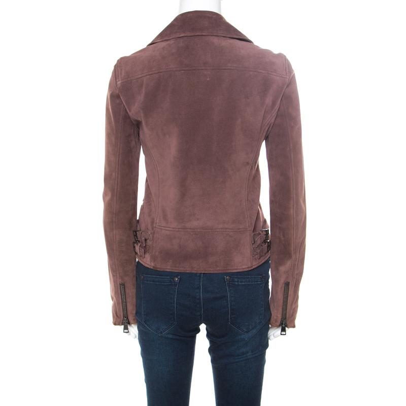 This fabulous biker jacket from Gucci is chic, stylish and very modern! The dull purple creation is made of 100% leather and features wide notched collars, an overlapping front zip closure, four zipped pockets and long sleeves. It is sure to lend