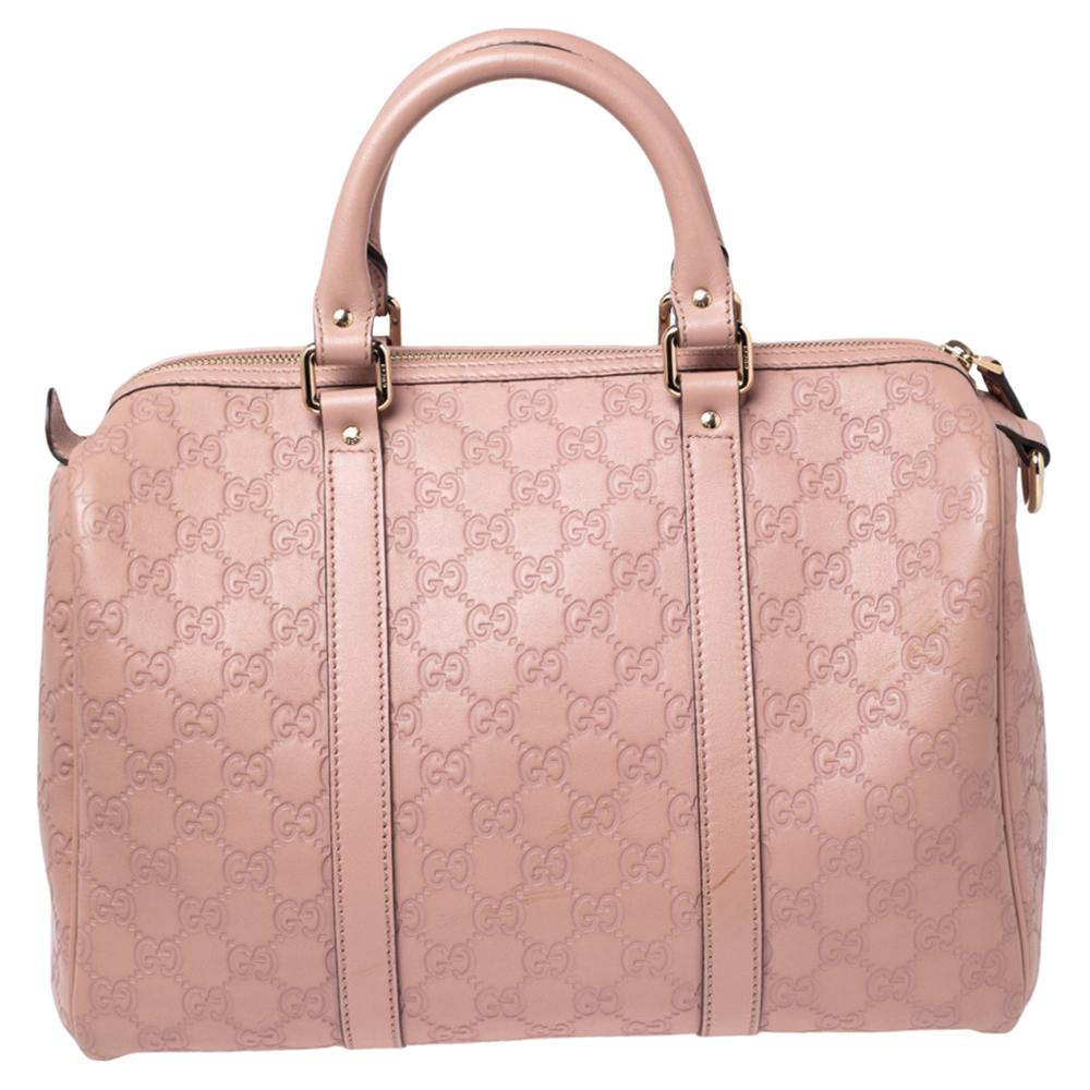 This classy Joy Boston bag from Gucci is a buy you won't regret! Crafted from Guccissima leather, the bag has a well-sized fabric interior and two top handles for you to easily swing it. It is complete with the brand label on the front.

Includes: