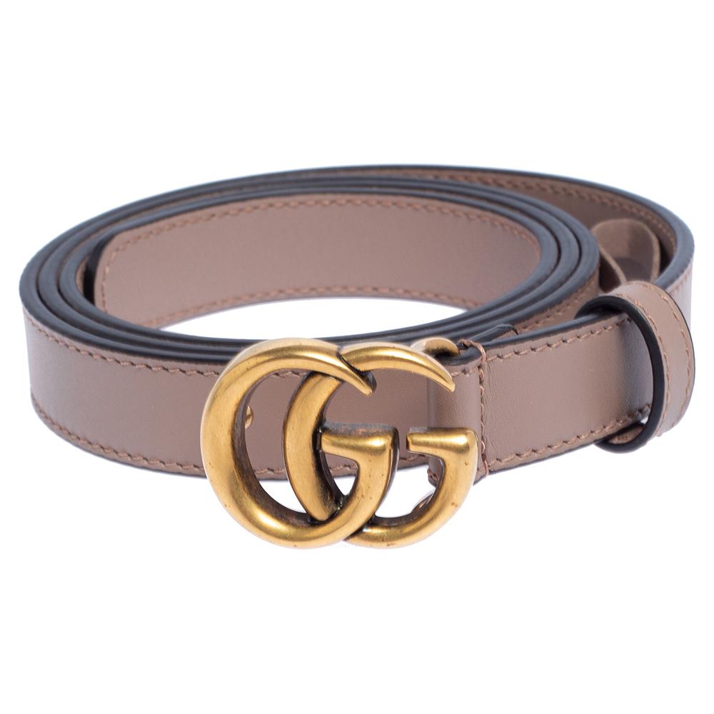 The Gucci belt has found a fan in fashionable people around the globe and it's time you get one for yourself too! This chic belt comes crafted from dusty pink leather and features the iconic GG buckle in gold-tone metal.

Includes: Original Dustbag
