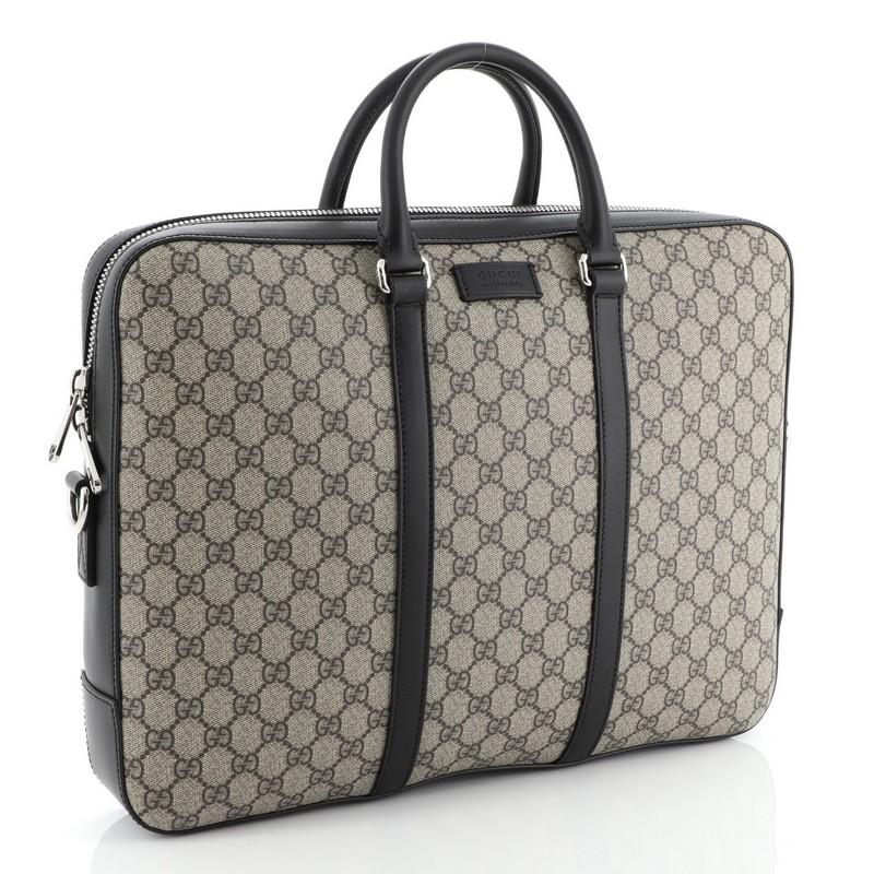 This Gucci Eden Briefcase GG Coated Canvas Large, crafted in brown GG coated canvas, features dual-rolled leather handles and silver-tone hardware. Its zip closure opens to a gray microfiber interior with zip pocket. 
Estimated Retail Price: