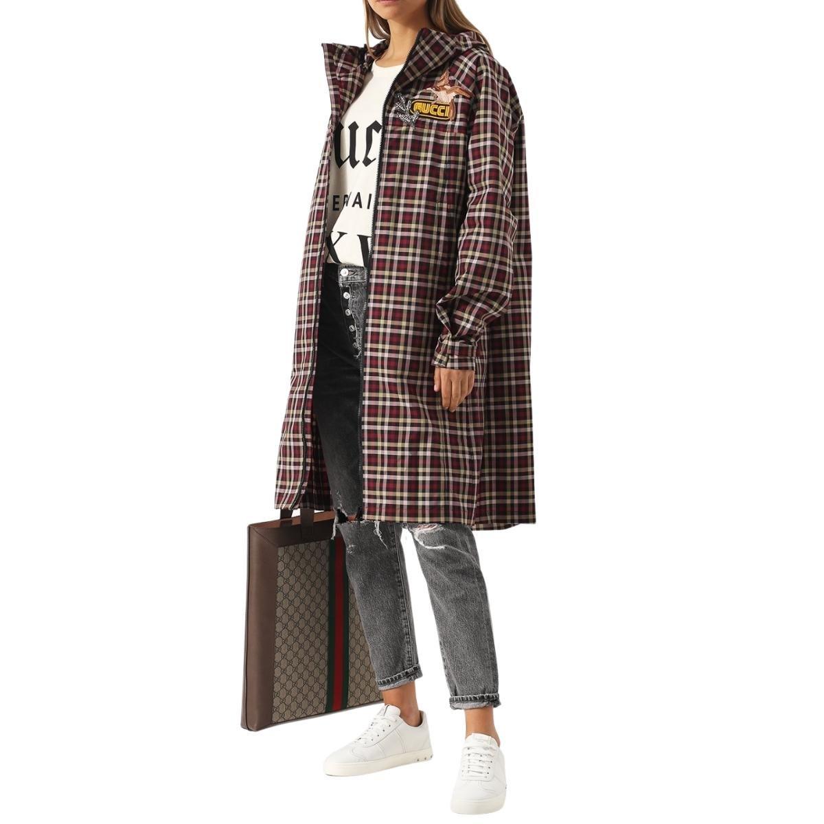 Multicoloured long hooded jacket from Gucci.
Fastened with two-way zip.
Enriched by embroidered check pattern, embroidered logo patch and encrusted appliqué.
Also features 2 slip pockets at front and velcro straps at sleeves.
Composition: Polyamide