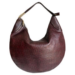 Bolso Hobo Glam de Gucci en piel repujada Horsebit con herrajes dorados