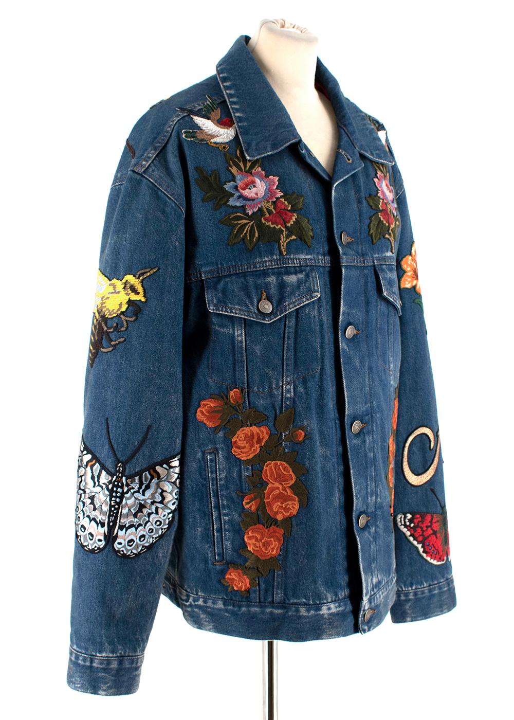 Gucci Embroidered Denim Jacket 

-Adorned with a mix of floral embroideries 
-Collections most recognizable motifs, including the butterfly, bee, tiger and the phrase 