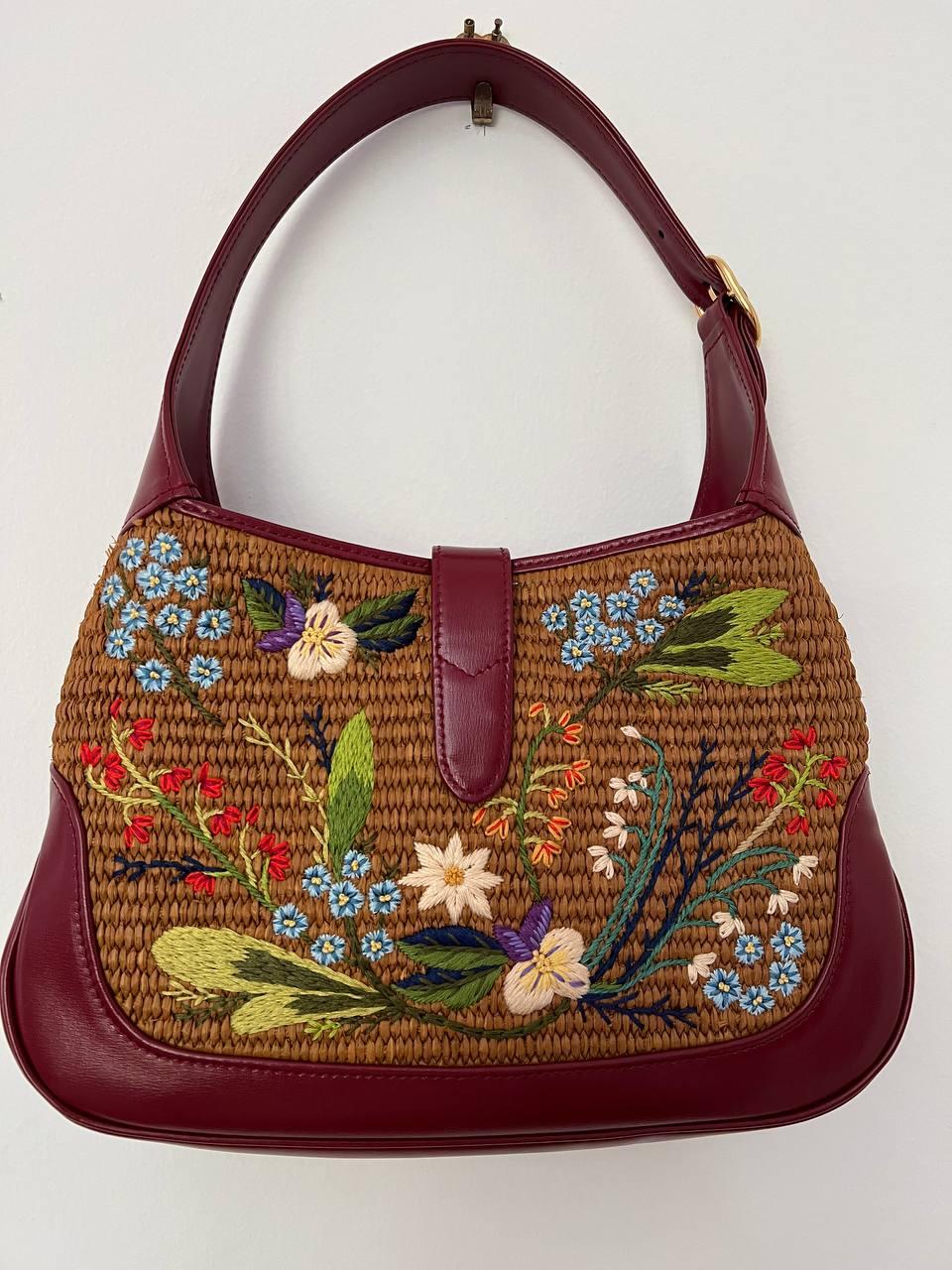 Iconic Jackie bag in small size with flower embroidery.
Limited edition.
Adjustable Shoulder Strap.
Canvas Lining & Single Interior Pocket
Measurements:
Shoulder Strap Length: 20.5″
Shoulder strap drop: 20.5″
Height: 7.5″
Width: 11″
Depth: