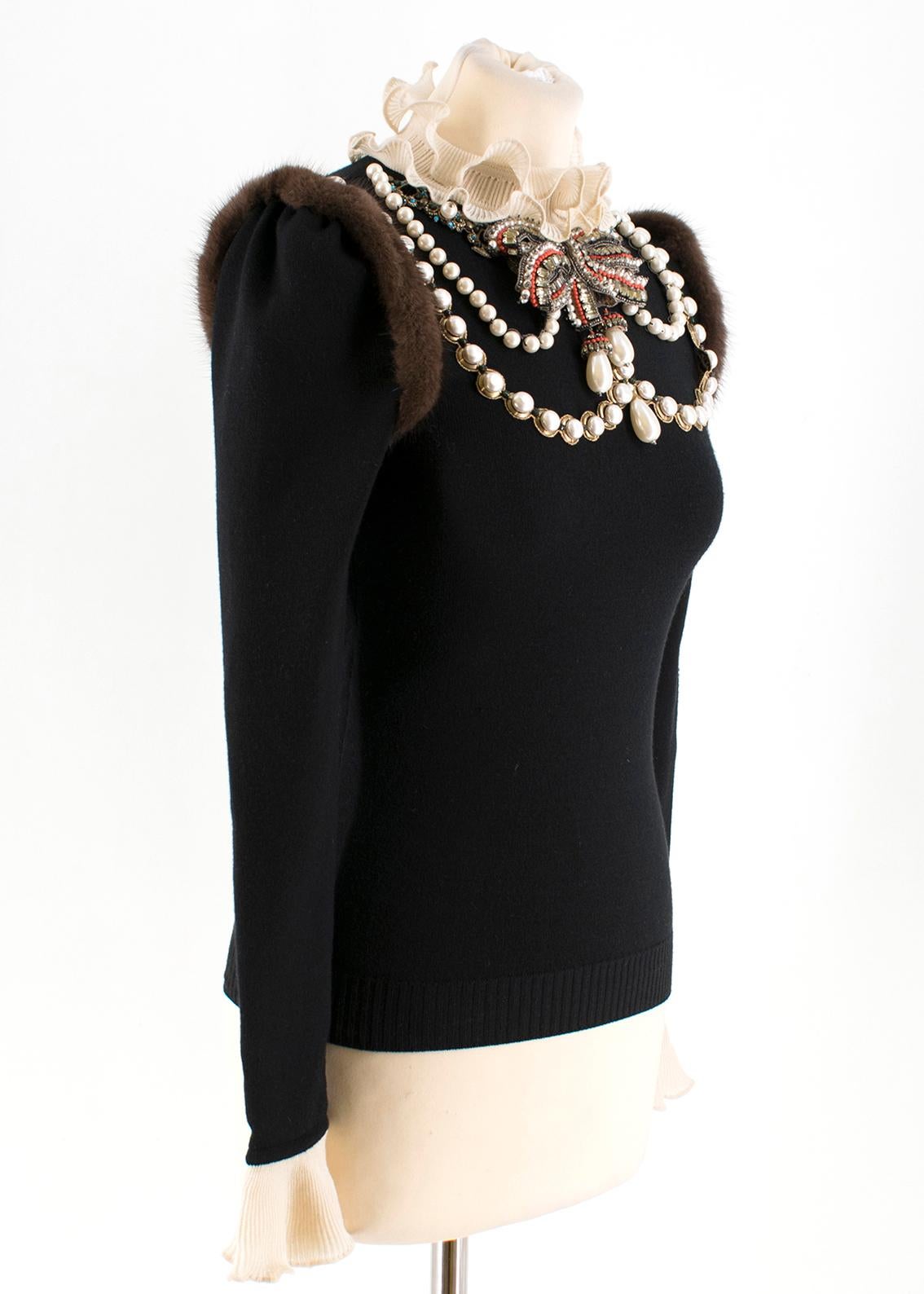 Gucci Embroidered Wool Knit Top with Mink Fur 

- Decorative Black Long Sleeve Knit Top 
- Layered necklace appliquÃ© 
crystals, glass pearls and velvet detail 
- Handmade embroidery with ruffled collar and cuffs
- Black fine stretch merino wool