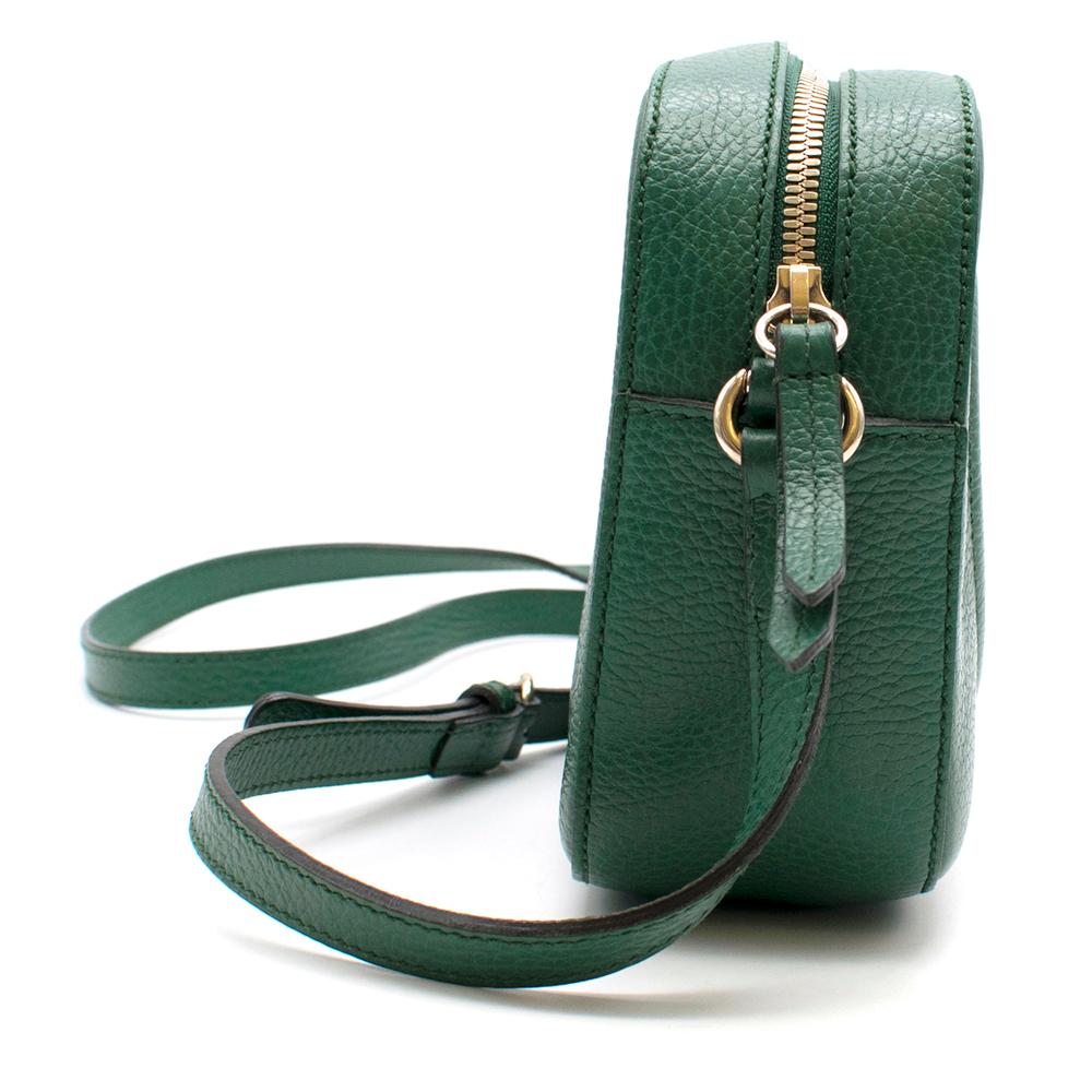 Gucci 'Soho Disco' bag in emerald leather. It's embossed with the label's iconic interlocking 'GG' logo. The bag holds your cell phone, cardholder and lipstick and other everyday essentials.

- Zip fastening along top
- Comes with dust bag

Please