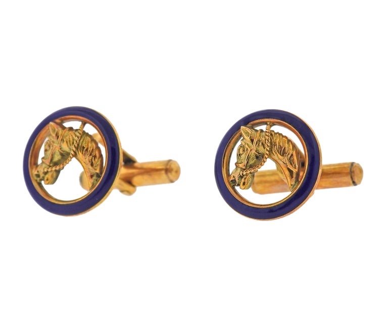 Pair of 18k gold equestrian cufflinks by Gucci, decorated with blue enamel, depicting horse heads. Cufflink top is 17mm in diameter. Weight - 12.9 grams. Marked: 750 Italy, 18k Gucci.