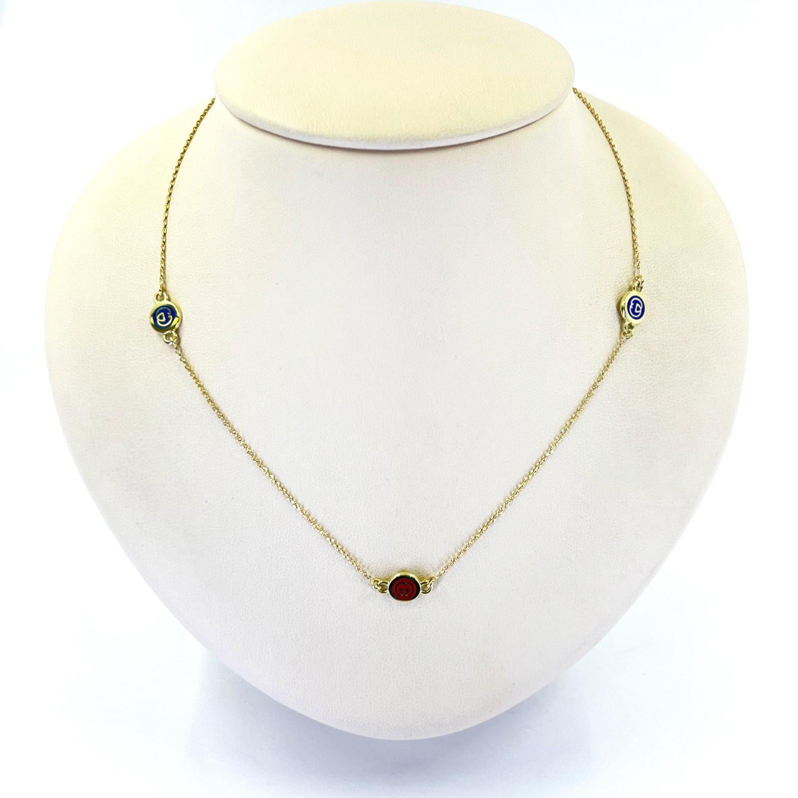 Gucci 18 Karat Yellow Gold Necklace Featuring 3 Round Stations with Blue and Red Enamel and Logo. 18 Inches Long. Finished Weight is 4.3 Grams.