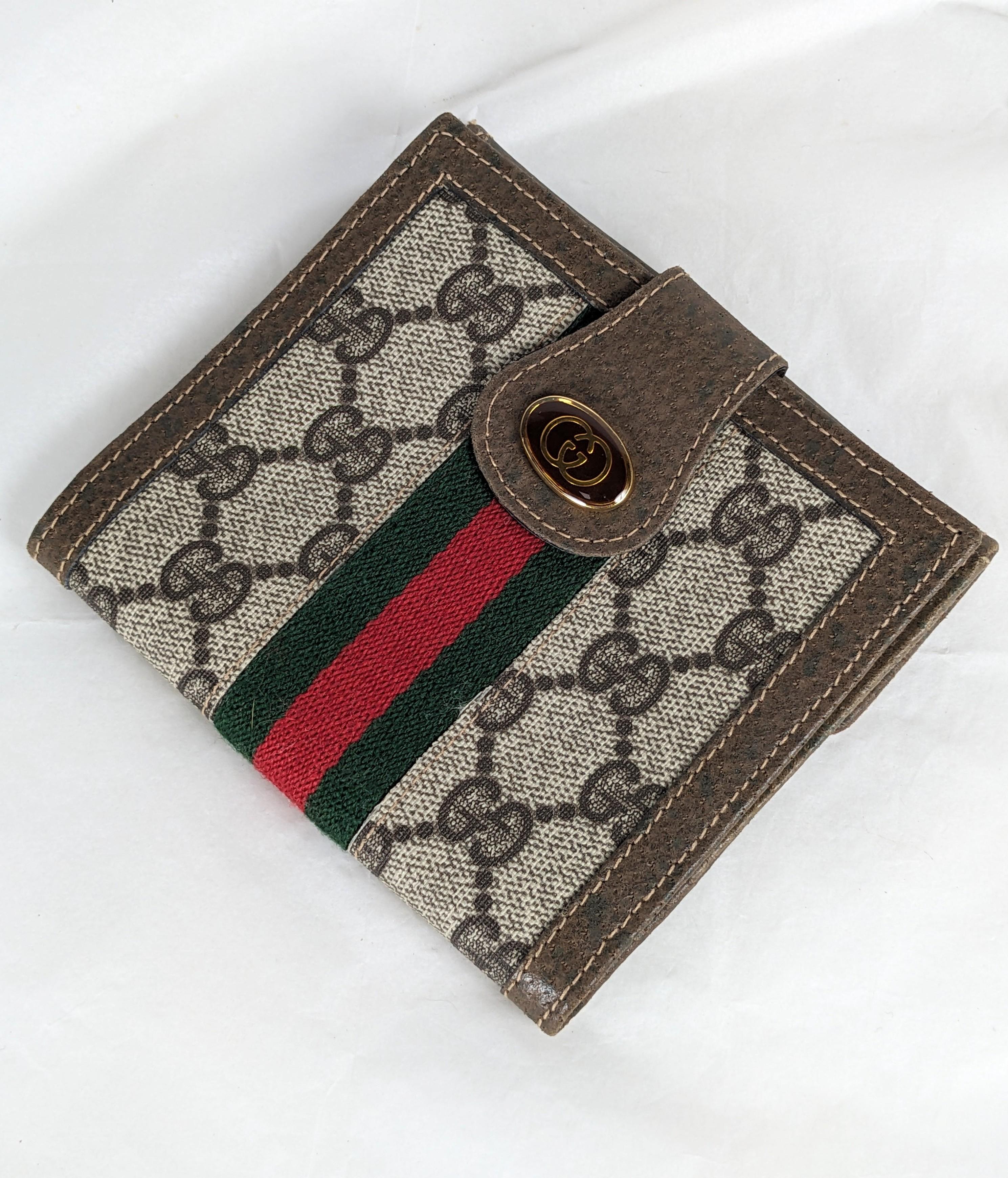 Portafoglio in pelle con logo smaltato Gucci  degli anni '90, Italia. 4,5