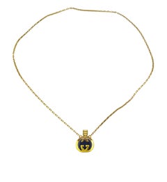 Gucci enameled logo perfume bottle necklace