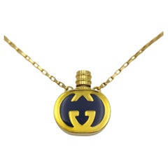 Gucci enameled logo perfume bottle necklace