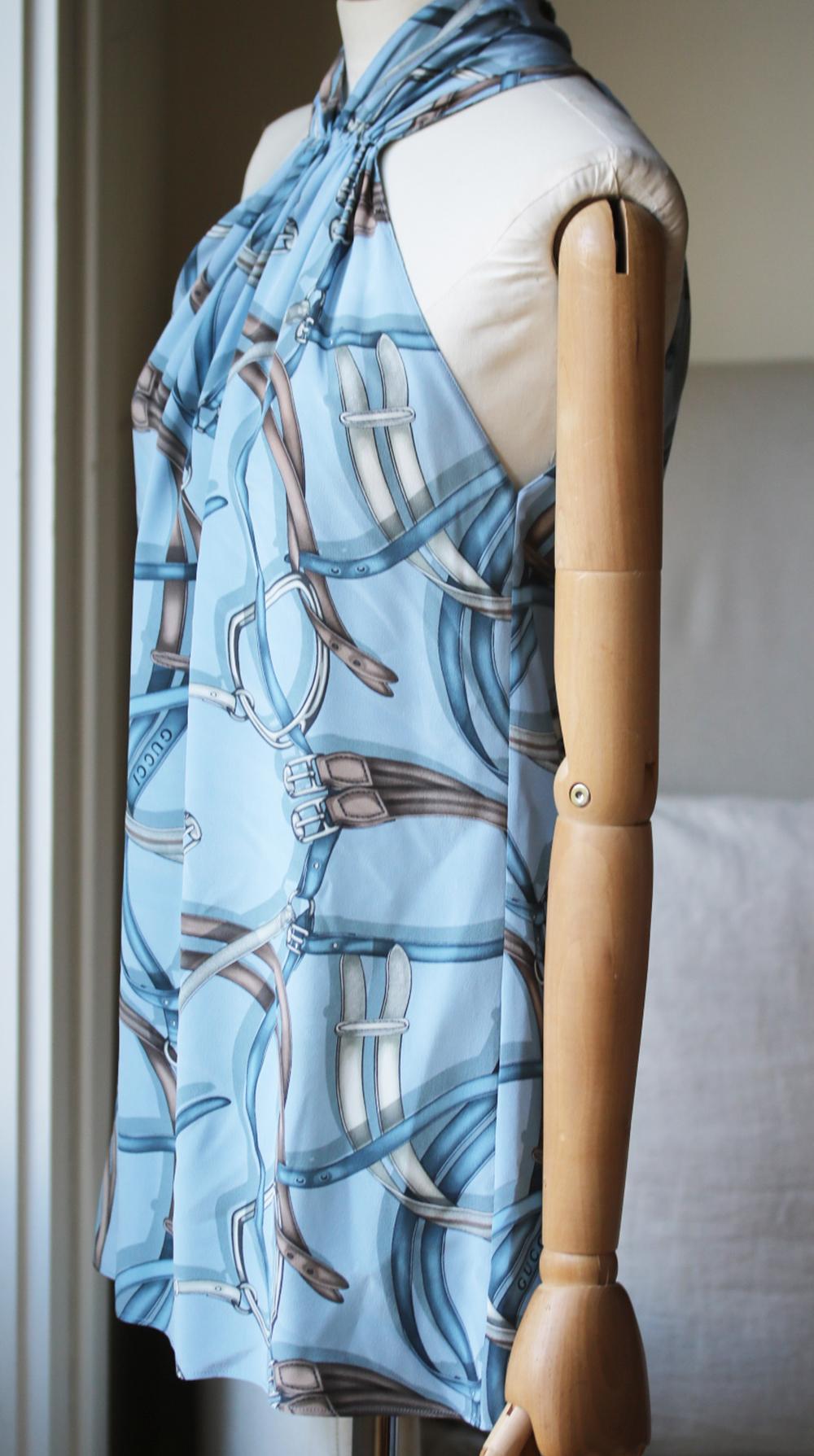 Part of Gucci's Equestrian collection. Equestion-print. Zip and hook fastening down the back. Halter neck, loose fit. 100% silk. Colour: blue. 

Size: IT 42 (UK 10, US 6, FR 38)

Condition: As new condition, no sign of war. 