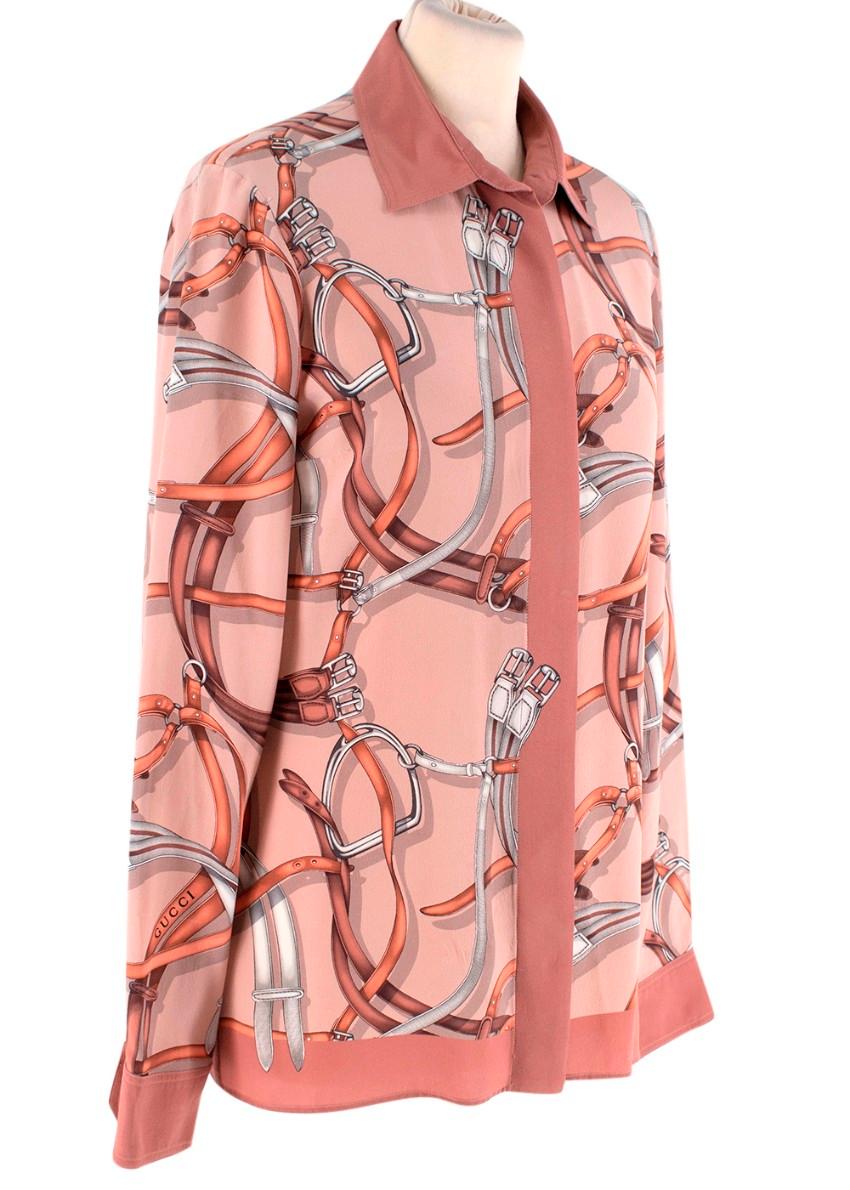 Gucci Equestrian Vintage Blush Pink Silk Bridle Print Blouse
 

 - Button up blouse in a blush pink features signature bridle all-over print in copper and silver hues
 

 Materials:
 The item does not have a care label but we believe it is a silk