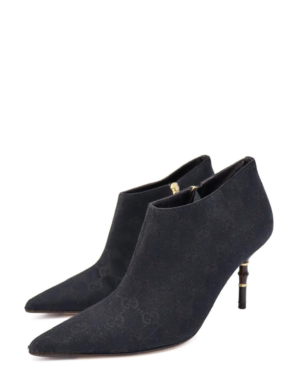 Gucci Black Vintage Monogram Pointed Toe Ankle Boots, Features a Bamboo Detailing on the Heel.

Additional information:
Material: Canvas 
Size: EU 36.5
Measurements: Heel: 8 cm 
Overall condition: Good 
Interior Condition: signs of use
Exterior
