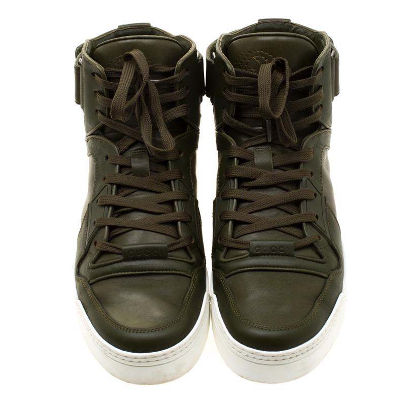 Give your feet the comfort and class they deserve with these stylish Gucci Basketball High Top sneakers. These leather sneakers in a lovely evergreen colour will surely make heads turn wherever you go.

Includes: Original Box

The Luxury Closet is