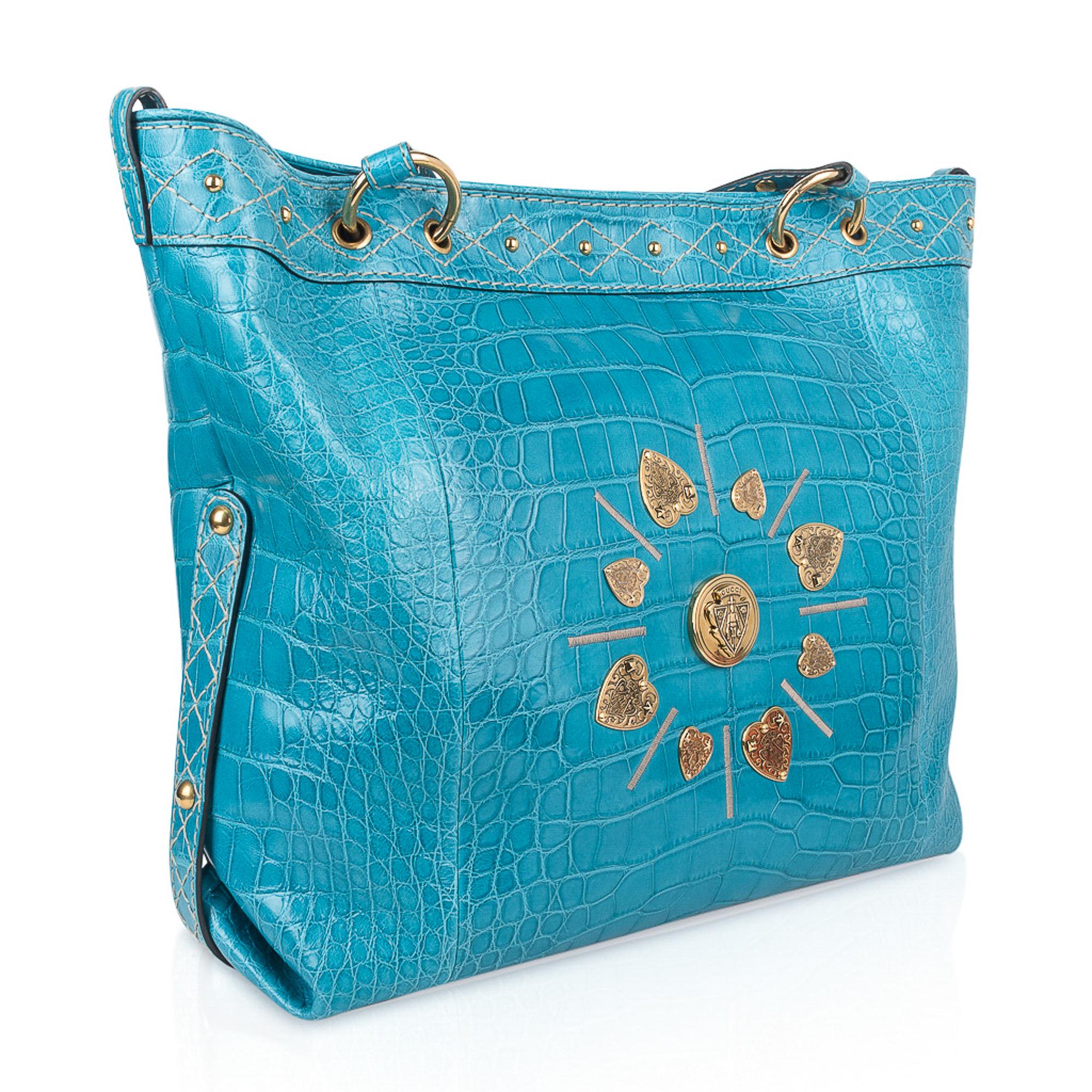 Gucci exclusive Limited Edition Turquoise fabulous large tote style bag featured in the softest, lightest Crocodile ever. 
This roomy treasure is a fantastic every day and travel bag! 
Magnificent color in a semi gloss skin.  Semi gloss is not the
