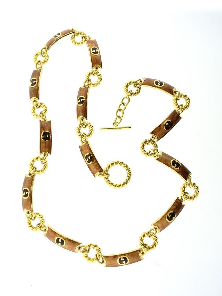 Gucci enamel vintage belt, an extra long length of 37 inches, can also be worn as a necklace also. This long chain/belt, in fine condition, can be worn at different lengths with the toggle closure. Signed Gucci, made in Italy, this is a colorful and