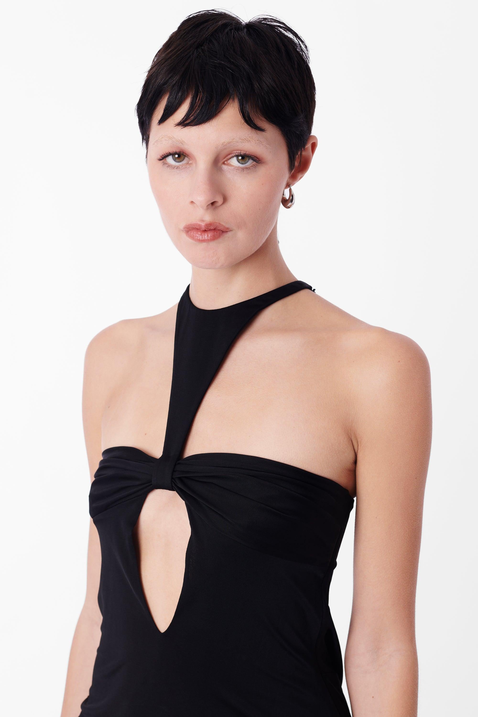 Tom Ford for Gucci Fall Winter 2004 black silk top. Features cut out detailing, high neck design, front open key-hole detail, side boning. In excellent vintage condition.
Brand: Gucci
Color: Black
Size: UK 10
Modern Size: UK: 10, US: 6, EU:
