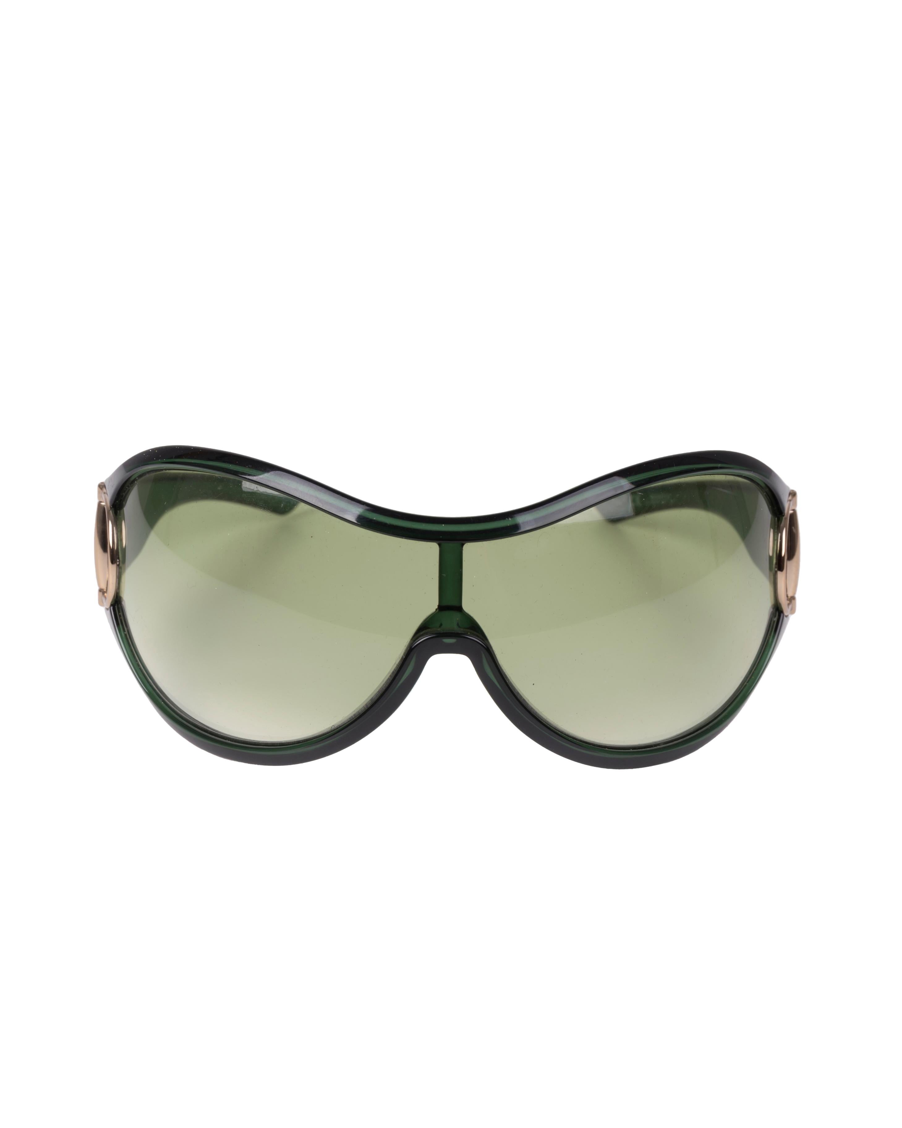 - Gucci by Alessandra Facchinetti
- Green acetate shield sunglasses
- Iconic metal horsebit as hinges
- Comes with original case