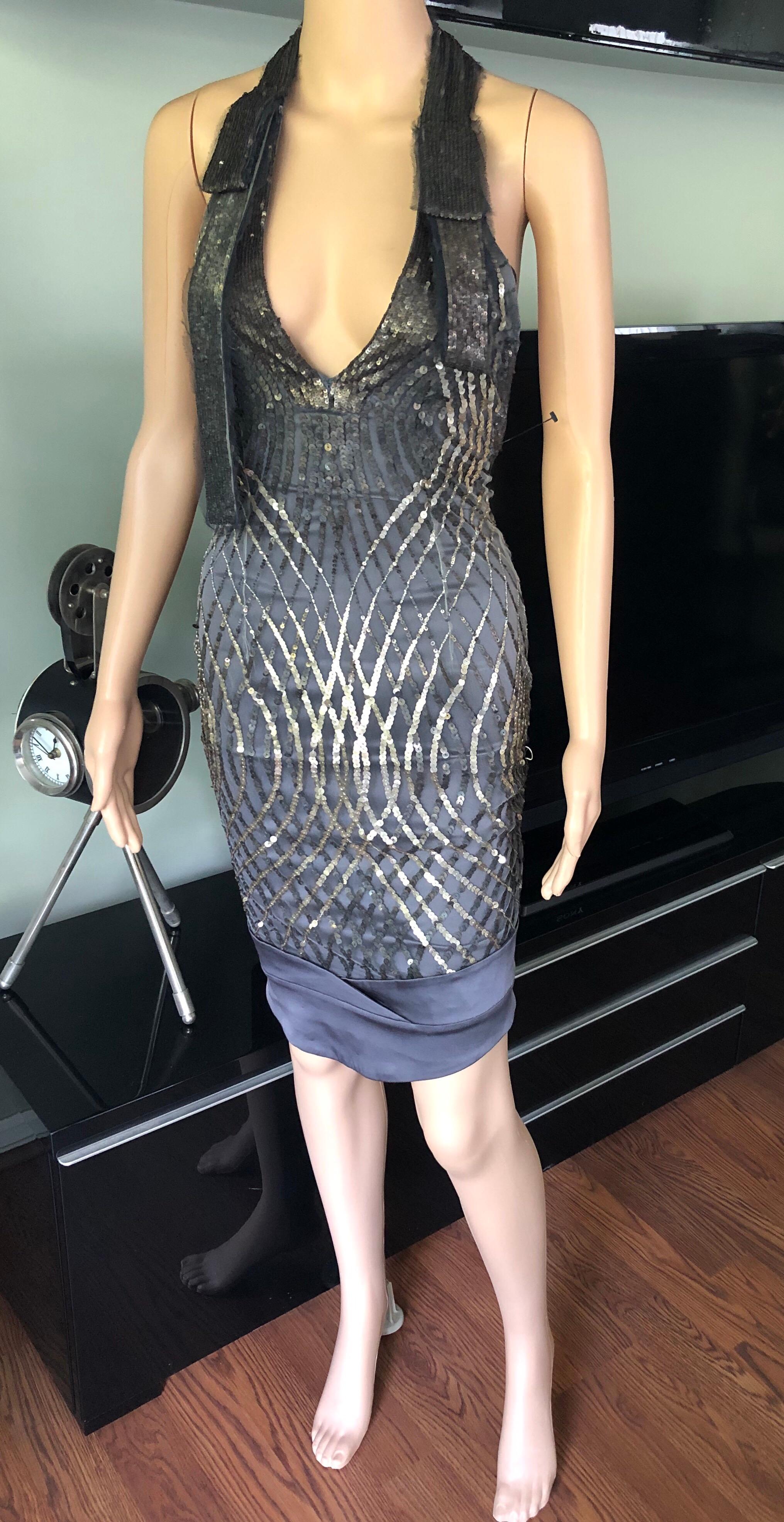 Gucci F/W 2005 Plunged Backless Silk Sequin Embellished Halter Dress XS/S

Gucci silk dress featuring sequin embellishments throughout, plunged halter neckline and concealed zip closure at back. Please note size tag has been removed. Please see