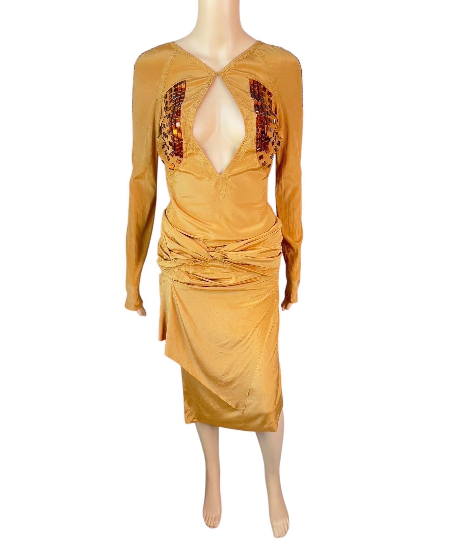 Gucci F/W 2005 Runway Embellished Plunging Keyhole Neckline Cutout Back Dress

Look 28 from the Fall 2005 Collection. 

Condition: good vintage condition, please note brand and size tags have been removed, fits like IT 40.

