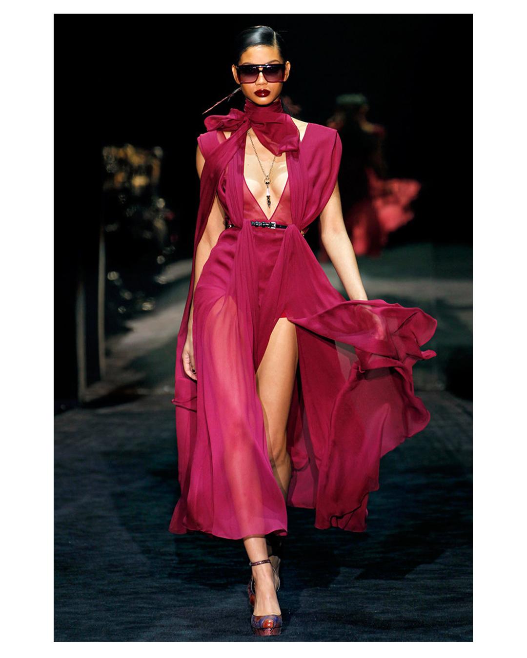 LOVE LALI Vintage

Gucci Fall 2011 midi length dress in burgundy
Sleeveless cut
Crinkle effect chiffon fabric
Partly sheer
Layered skirt
Long ties can be wrapped around the waist or the neck as seen on the runway
Concealed side zip
Gucci engraved