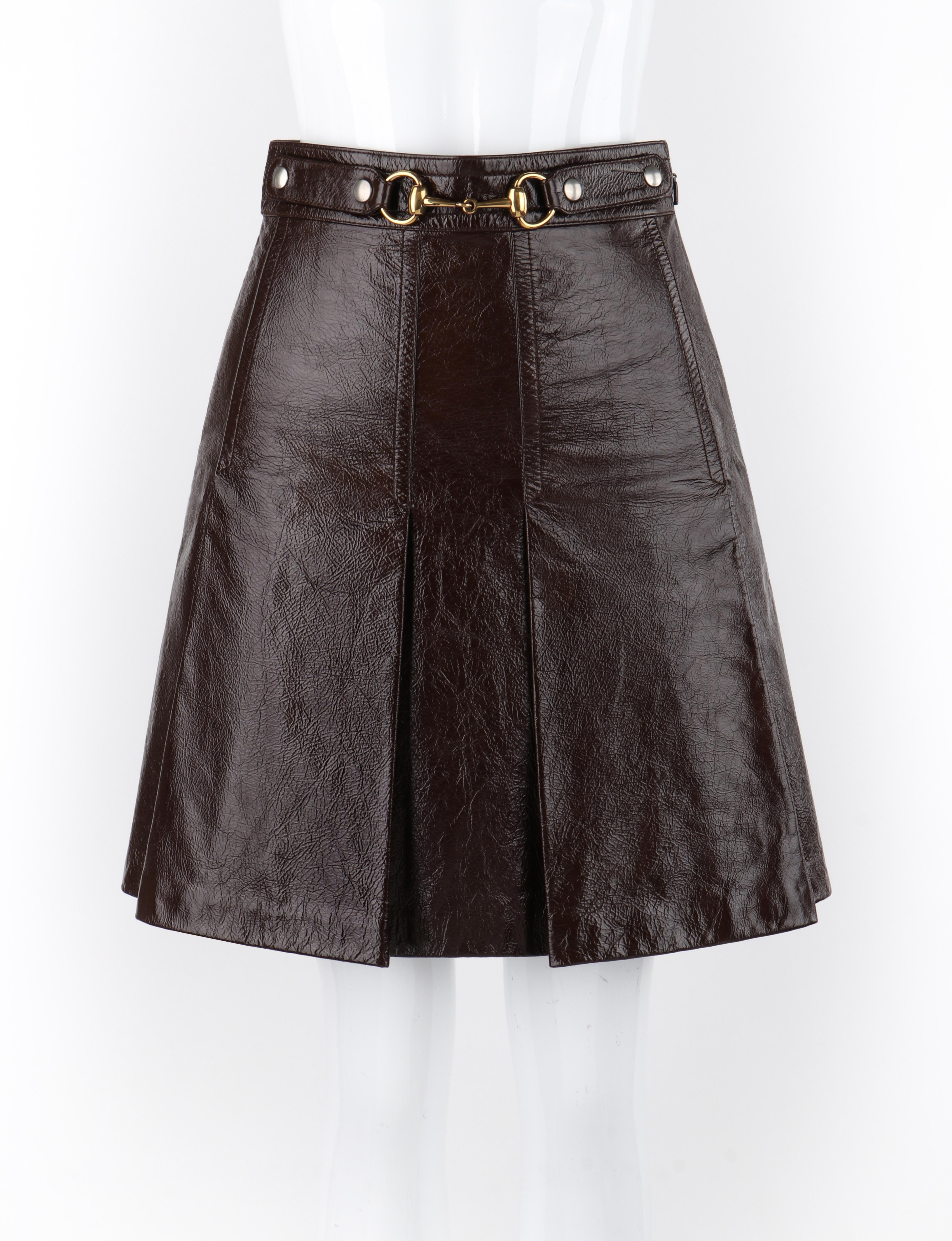 GUCCI Fall 2017 Brown Genuine Leather Gold Horsebit Buckle Pleated Mini Skirt

Brand / Manufacturer: Gucci
Collection: Fall 2017
Designer: Alessandro Michele
Style: Mini Skirt
Color(s): Shades of brown, gold, silver
Lined: Yes
Marked Fabric Content: