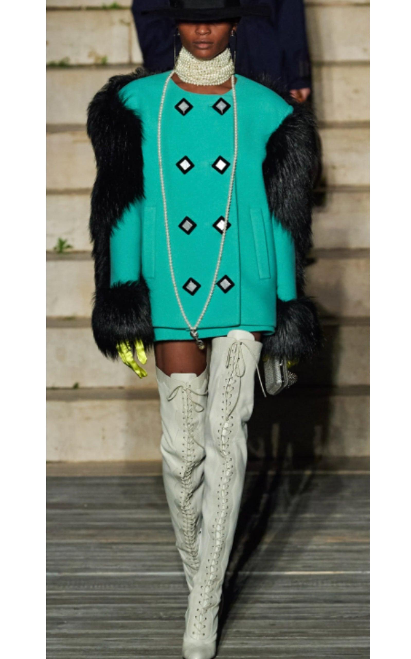 This glamorous jacket is defined by its opulent faux fur-trims. Crafted from a wool-blend, the style has a double-breasted silhouette with duo-tone squared buttons.
Embossed gold-tone buttons. 
Stand up collar
Front buttons fastening
Faux fur