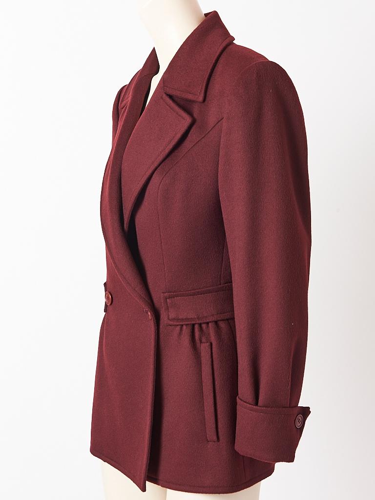 Gucci, aubergine tone, cashmere, double breasted, jacket/blazer having a defined waist,  
wide lapels and slight gathers at the hips. Stitched in place half belt goes around the back, with more gathering detail at the back. There are slit pockets at