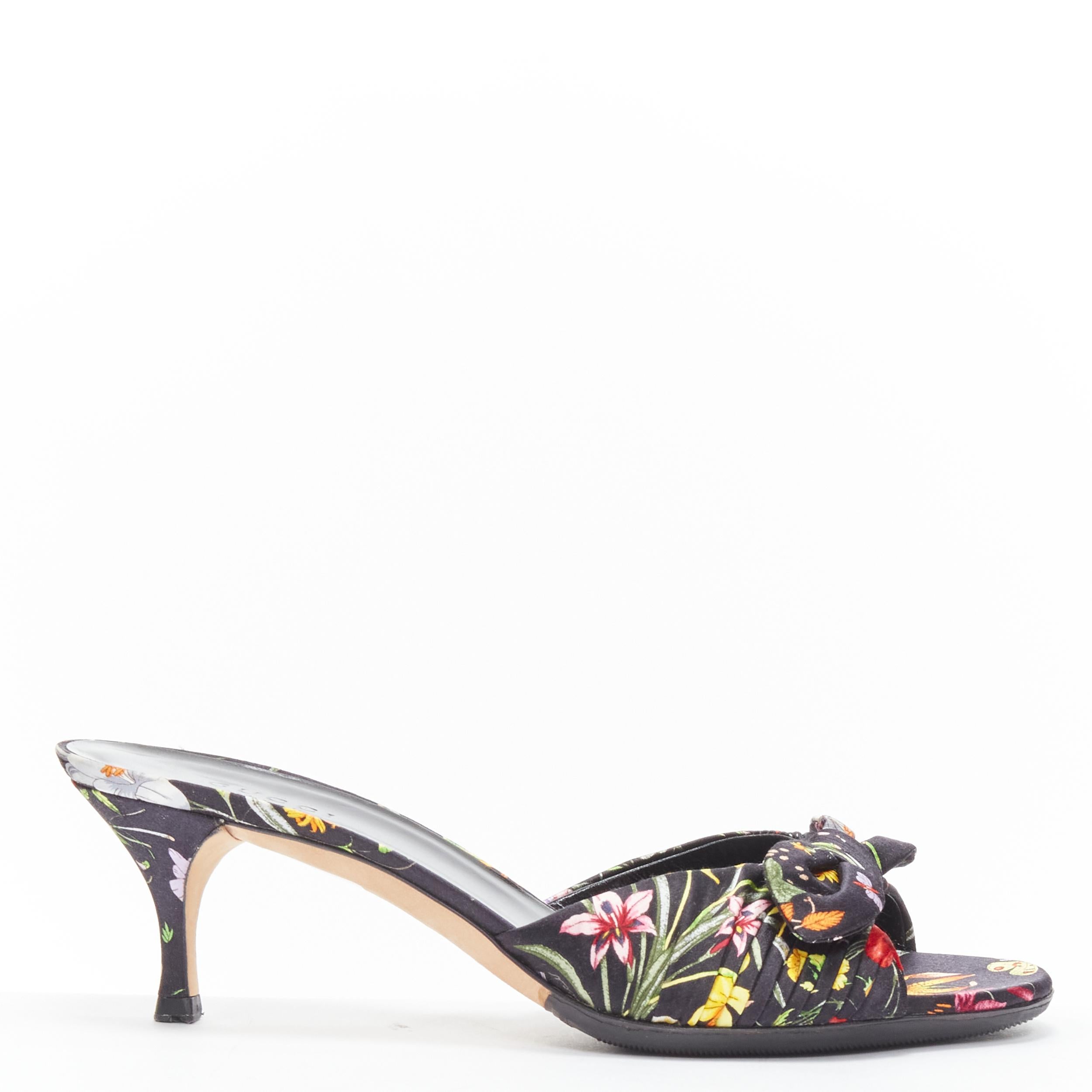 GUCCI Flora black floral print silk twist bow kitten heel mule sandals EU36 US6 
Reference: CELG/A00228 
Brand: Gucci 
Model: Floral mule 
Material: Silk 
Color: Black 
Pattern: Floral 
Extra Detail: Bow detail at toe. Open toe. 
Made in: Italy