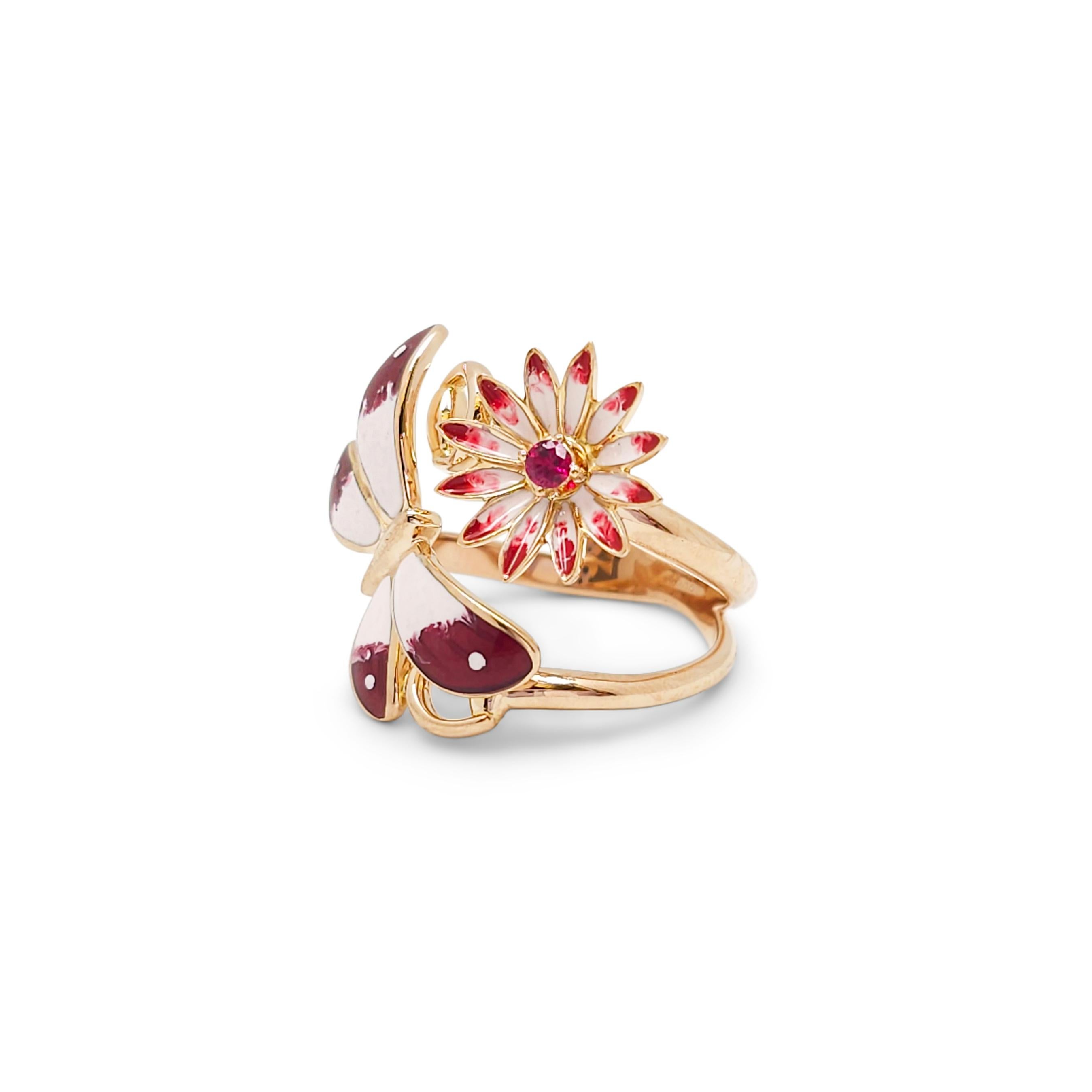 Authentic Gucci Flora butterfly ring crafted in 18 karat rose gold.  The effervescent design features an enamel butterfly and flower studded with a bezel-set ruby center, mounted on the iconic Gucci horse bit motif.  Size 13 (US 6 1/4, EU 53). 