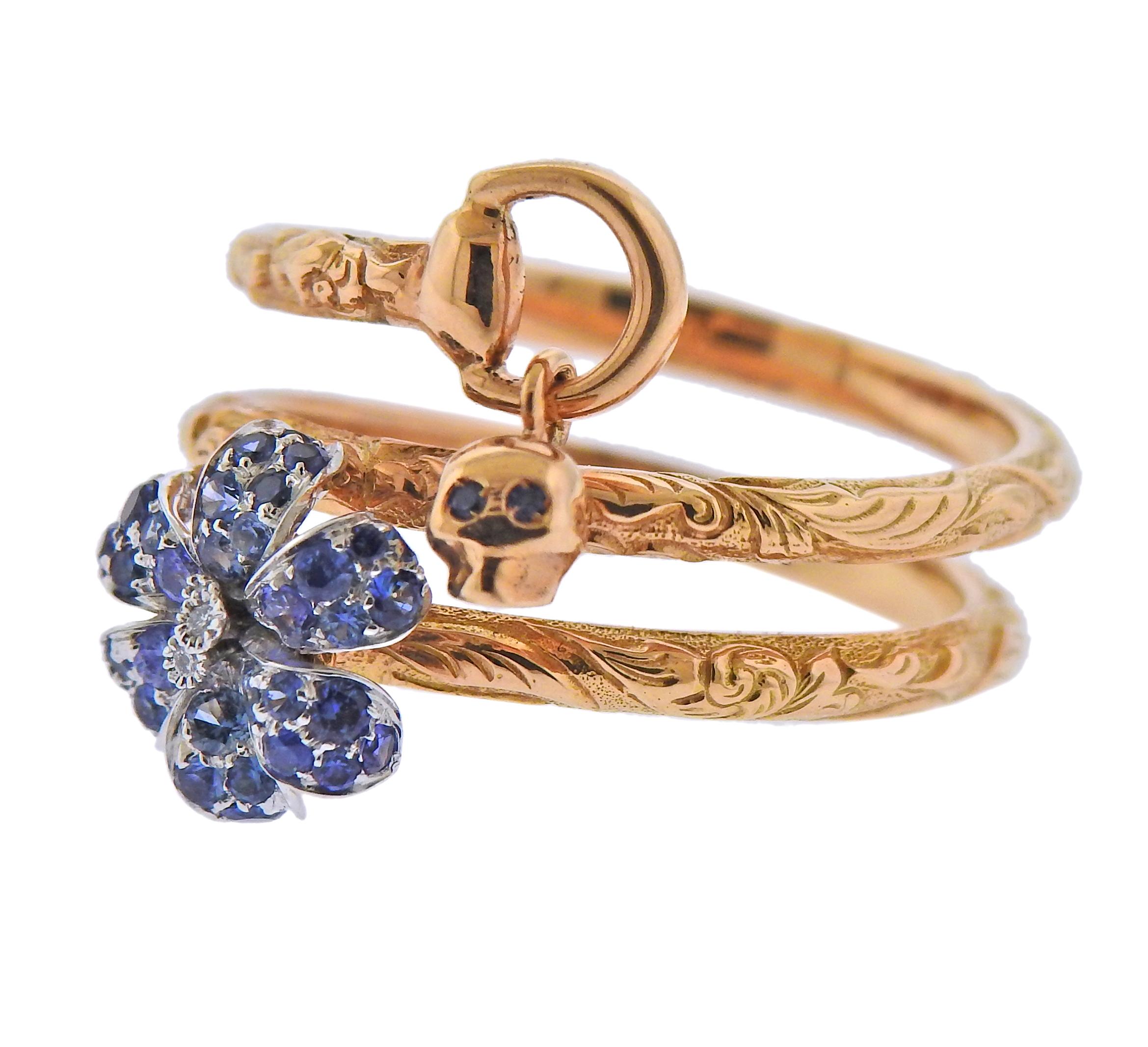 New Gucci Flora flower ring in 18k rose gold, with sapphires and approx. 0.02ctw in G/VS diamonds. Ring size - 6.75, ring is 22mm wide.  Weight - 6.9 grams. Marked: Au750, Gucci, made in Italy. 
