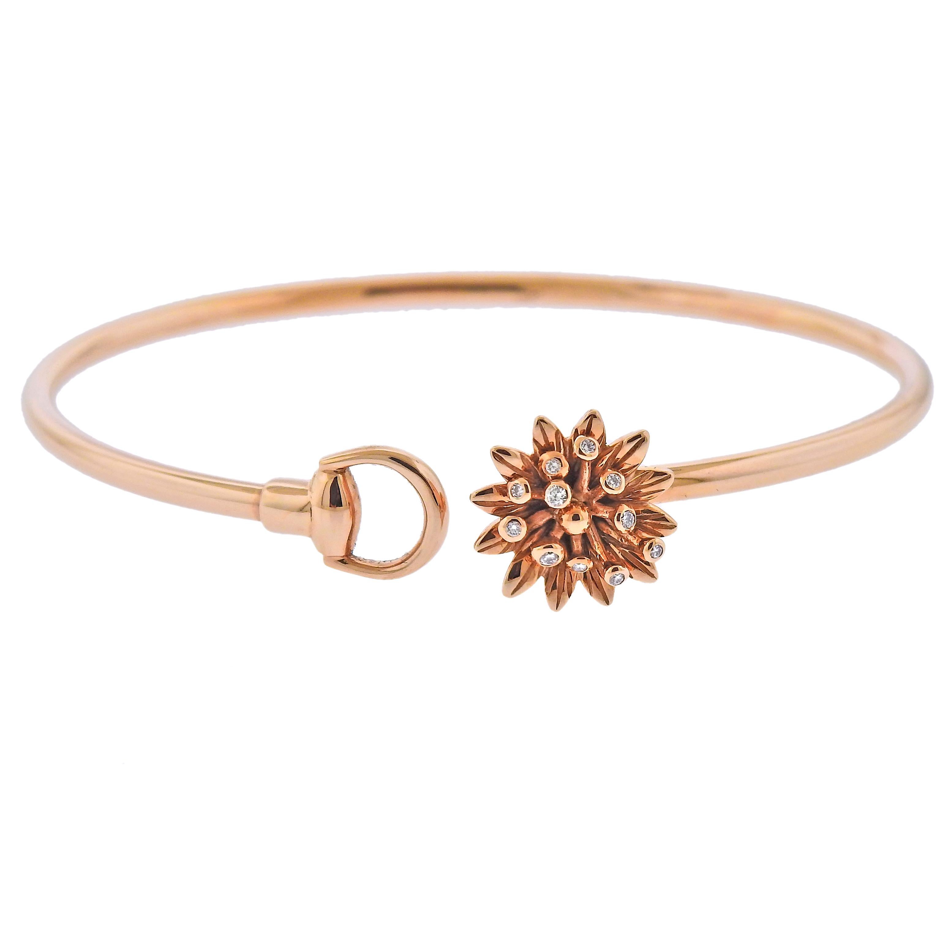18k rose gold bracelet crafted by Gucci. Set with 0.05ctw of VS/G diamonds. 55mm wide, will comfortably fit 6 3/4