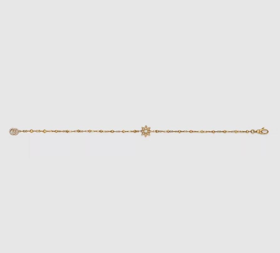 18k yellow gold
64 diamonds, totaling approximately .22 carats
Clasp closure
Double G: .25