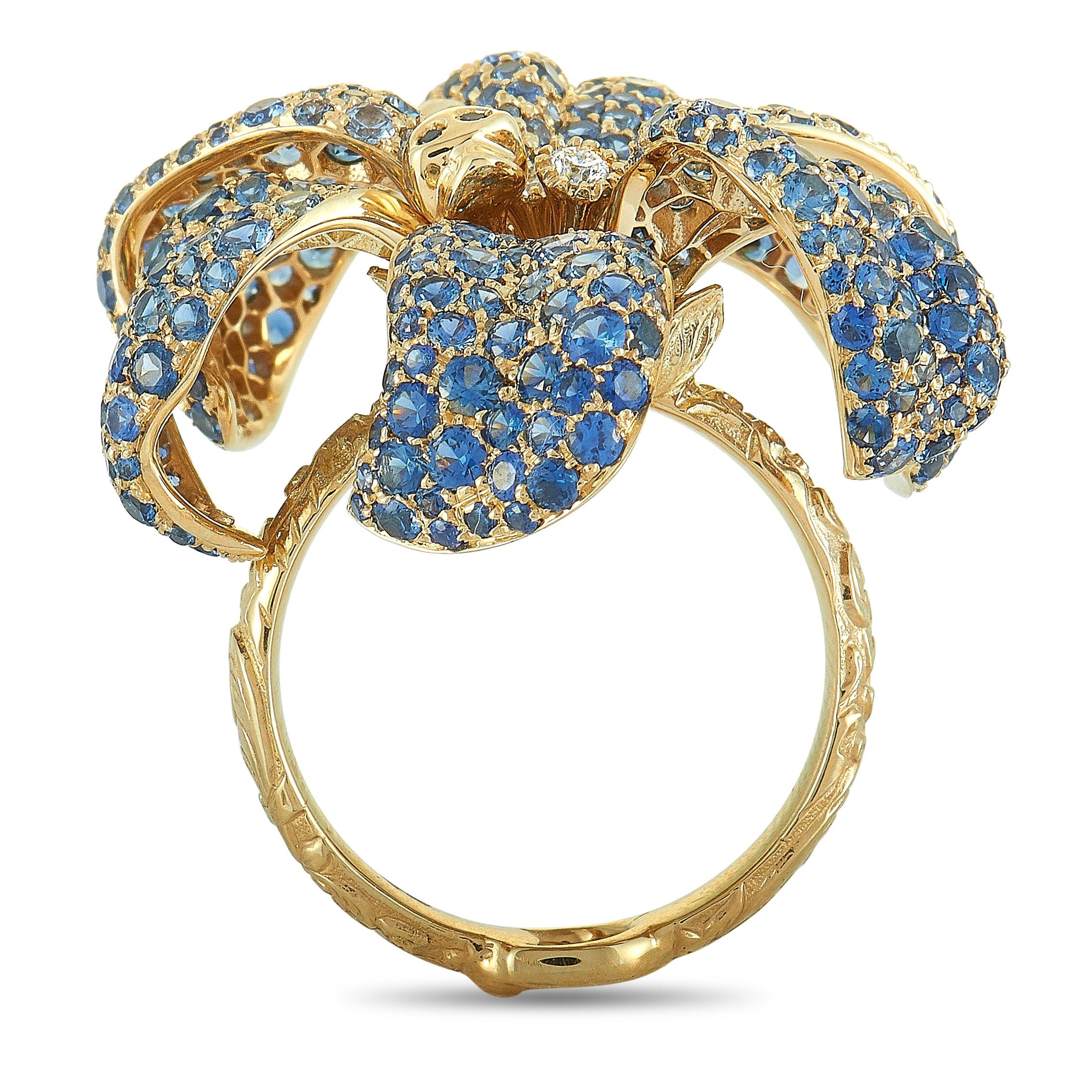 The “Flora” ring by Gucci is crafted from 18K yellow gold and set with a total of 7.29 carats of blue sapphires and 0.05 carats of diamonds. The ring weighs 15.7 grams, and boasts band thickness of 3 mm and top height of 10 mm, while top dimensions