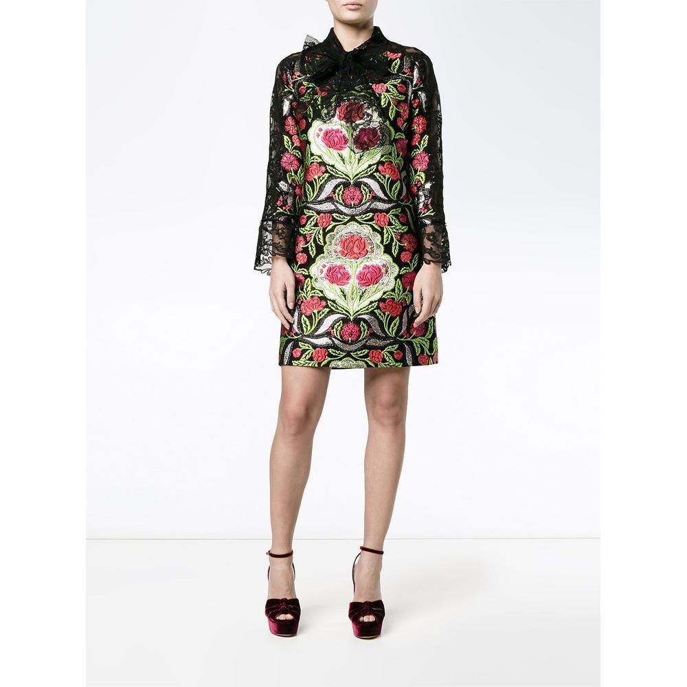 Gucci's floral brocade and lace dress captures the whimsical spirit of the fashion house with its self-fastening neck tie, multicolour floral brocade and black sheer lace panels making for a striking silhouette.

This Italian-made Gucci dress