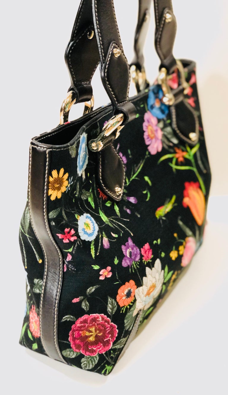 - Gucci black floral print canvas tote handbag. Feels like carrying a garden with you at all time!

- Length: 30.5cm
- Height: 24cm
- Width: 10cm
- Handle Drop: 18 cm


