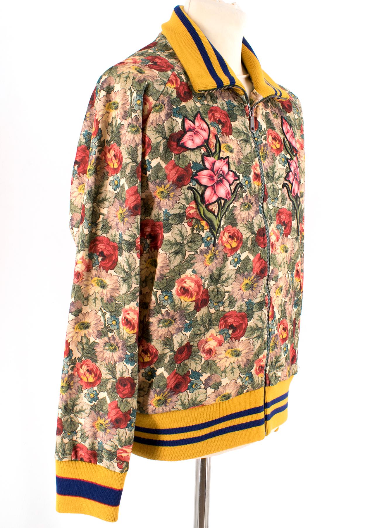 Gucci Floral Print Jacket 

Floral print jacket
Centre zip closure 
Silver hardware 
Cream interior 
Two exterior pockets with green hardware
Embroidered flowers 
Yellow with blue stripe detailing ribbed neck line, hem and cuffs 
High neck
Oversize